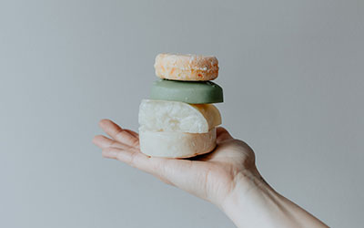 picture of a person holding soap bars